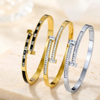 Pulsera de acero de titanio con doble punta, incrustaciones de oro.