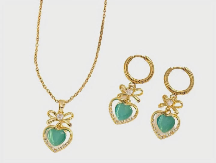 Conjunto de collar y pendientes con circonitas sintéticas verdes en forma de corazón y efecto ojo de gato, con cadena tipo «O»